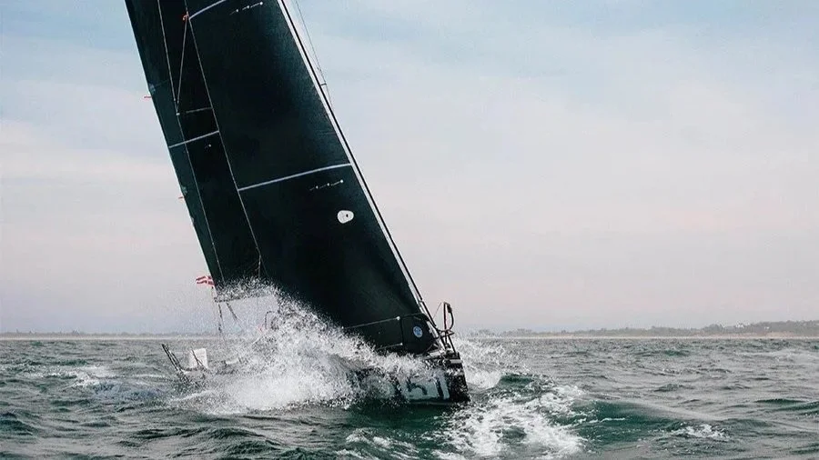 A racing sailboat powered by a North Sails 3Di sail.
